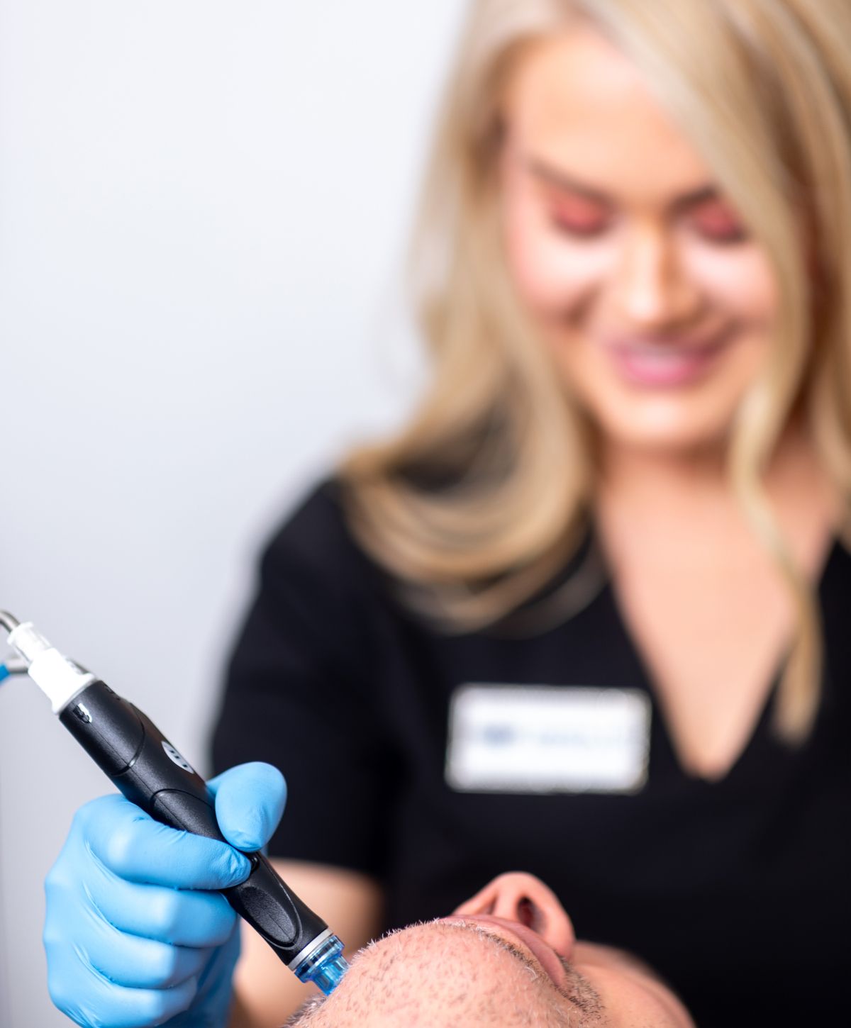 aesthetics nurse injector patient model performing treatment on a patient model