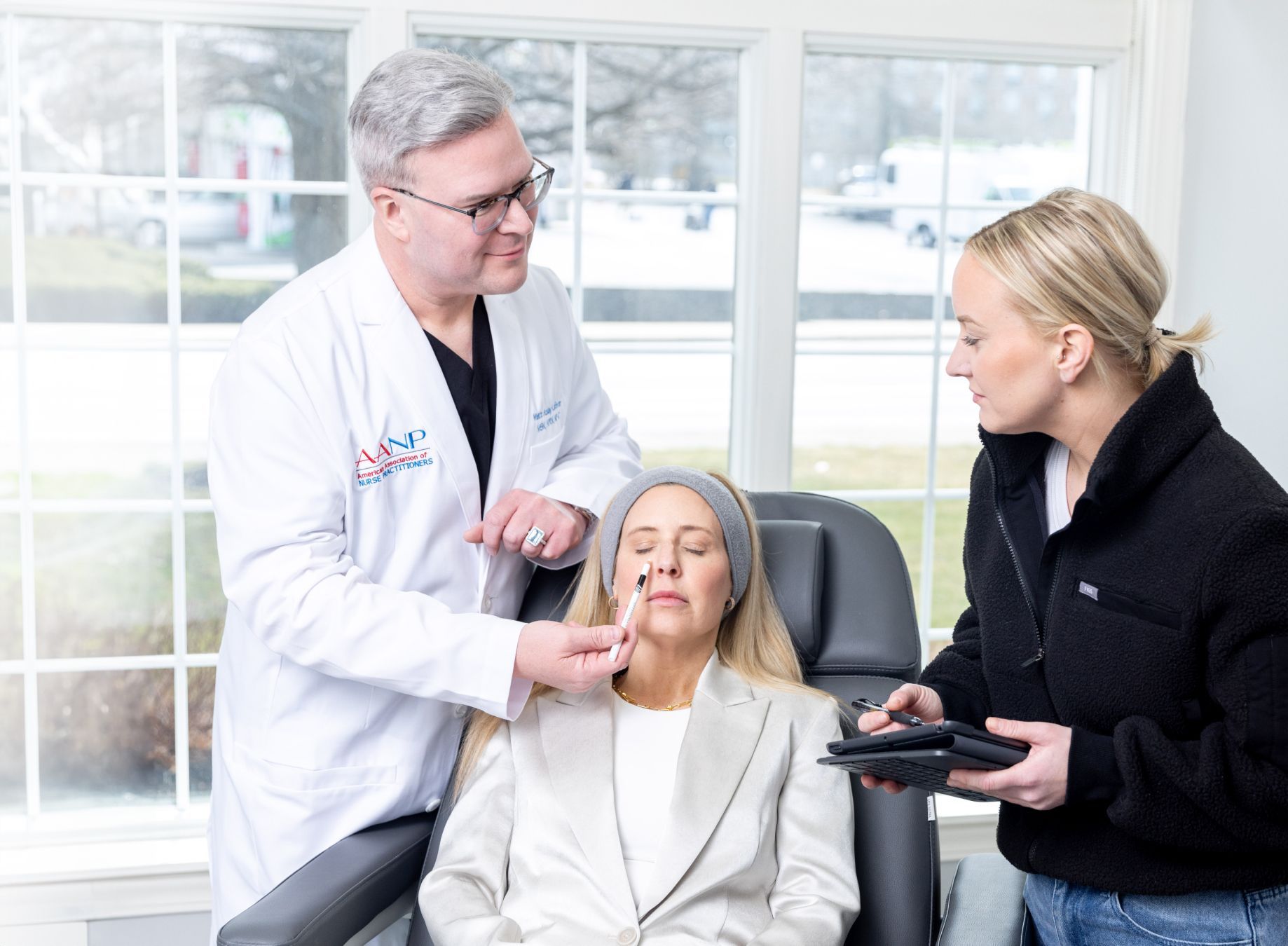 Matt Azulay-LaFever with a student model and a patient