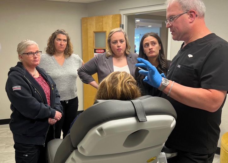 Matt Azulay-LaFever with neurotoxin training course students demonstrating someting