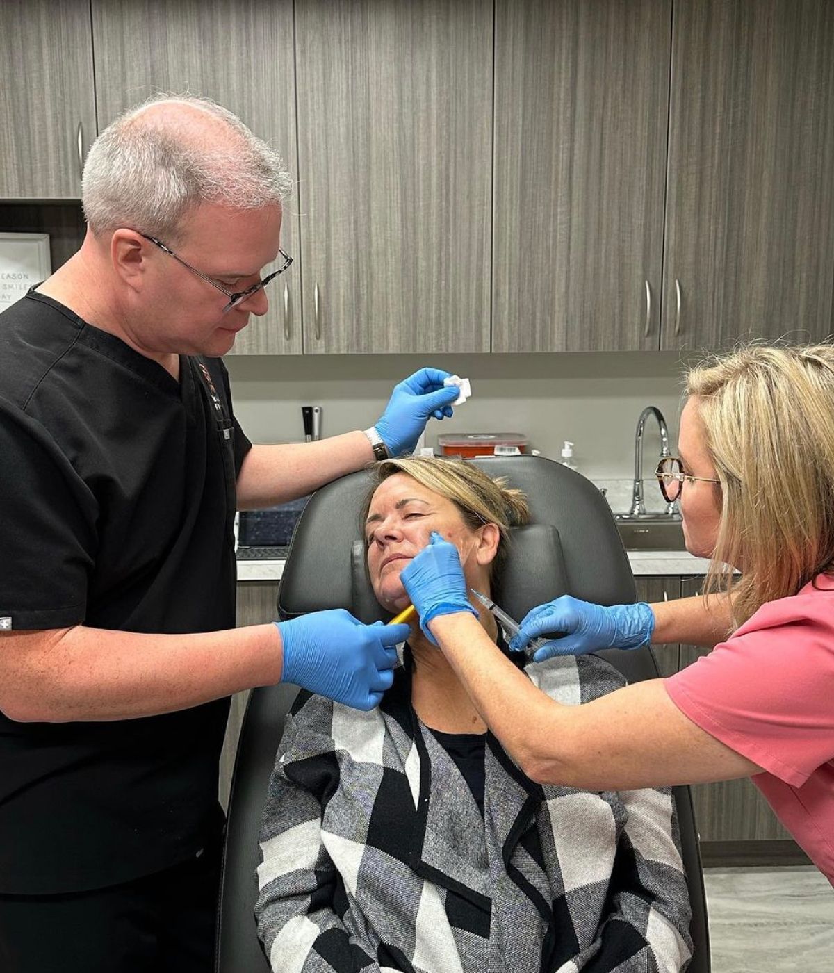 Matt Azulay-LaFever assisting a student giving an injectable to a patient model